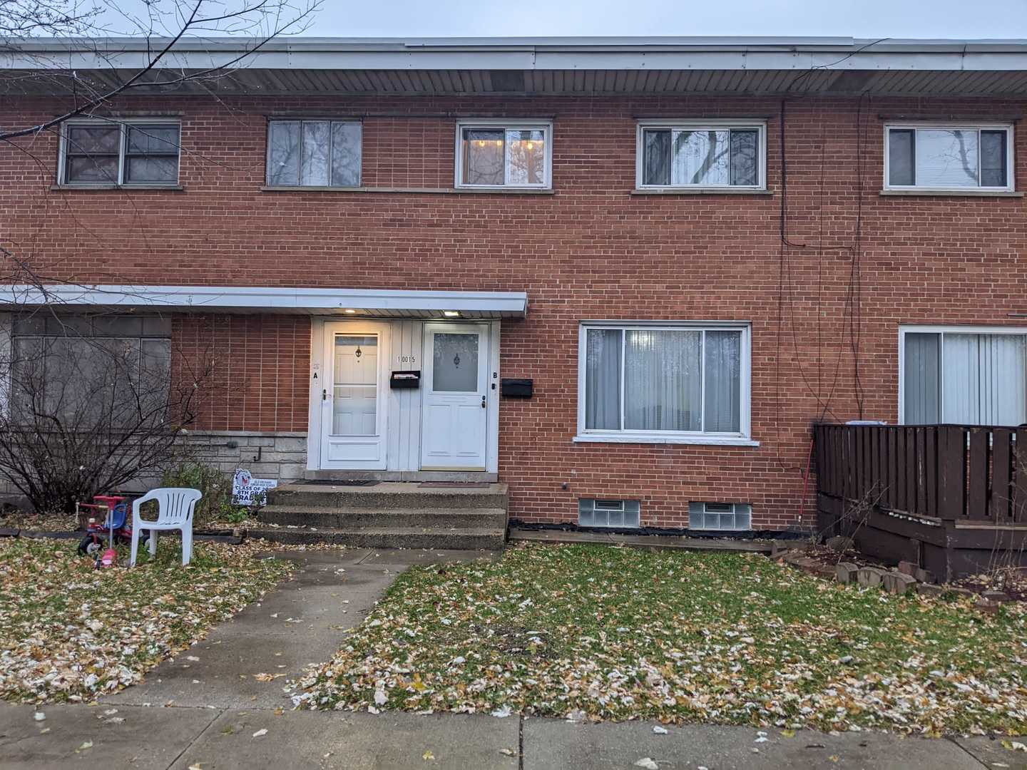 10015 Frontage Road, Unit B Skokie, IL 60077 - Photo 1 of 20 a front view of a house with garden
