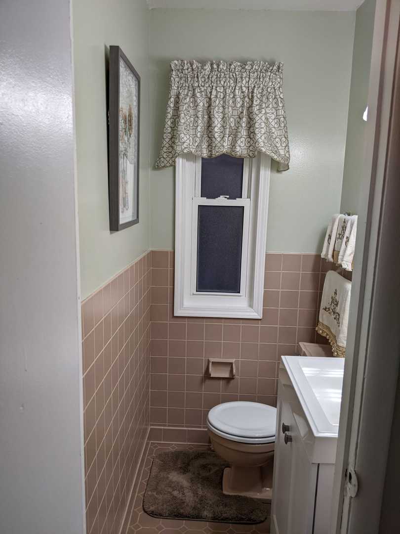 10015 Frontage Road, Unit B Skokie, IL 60077 - Photo 14 of 20 a bathroom with a toilet and a sink