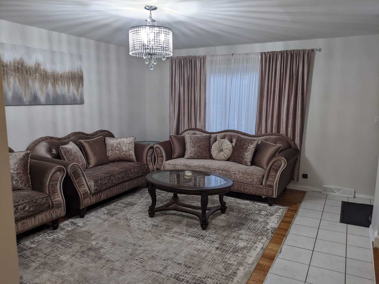 10015 Frontage Road, Unit B Skokie, IL 60077 - Photo 3 of 20 a living room with furniture and a chandelier