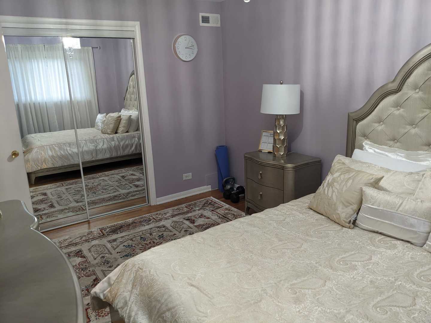 10015 Frontage Road, Unit B Skokie, IL 60077 - Photo 7 of 20 a bedroom with a bed and a mirror