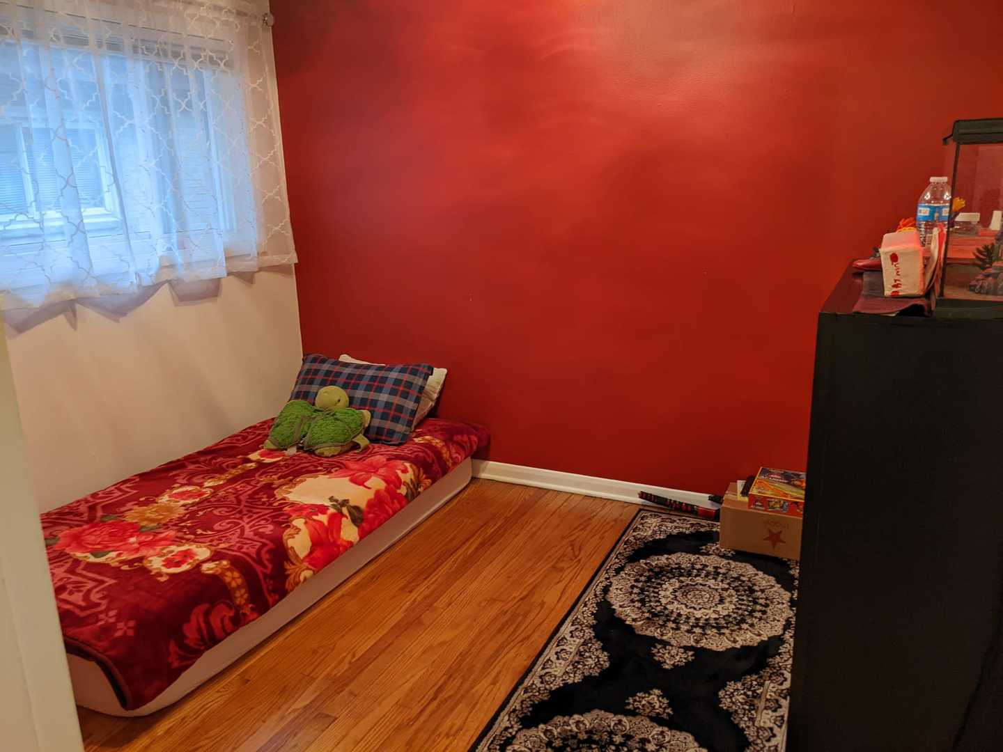 10015 Frontage Road, Unit B Skokie, IL 60077 - Photo 8 of 20 a bed sitting in a bedroom next to a window