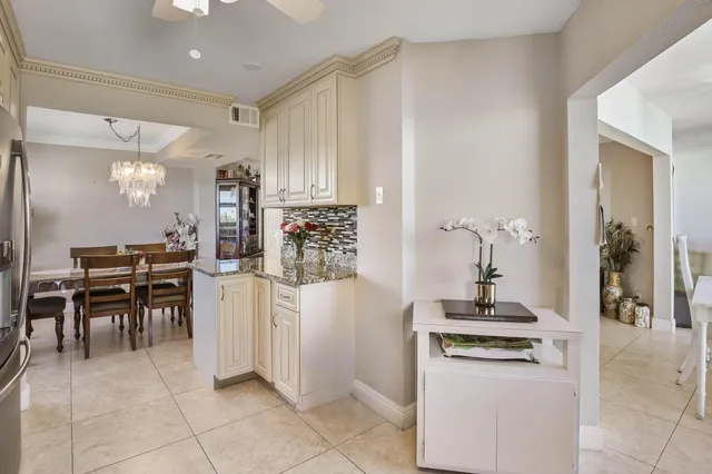 a kitchen with appliances cabinets and furniture
