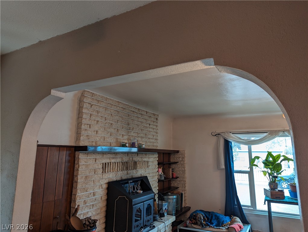 561 Main Street Caliente, NV 89008 - Photo 13 of 32 Detailed view of arched walkways and a wood stove