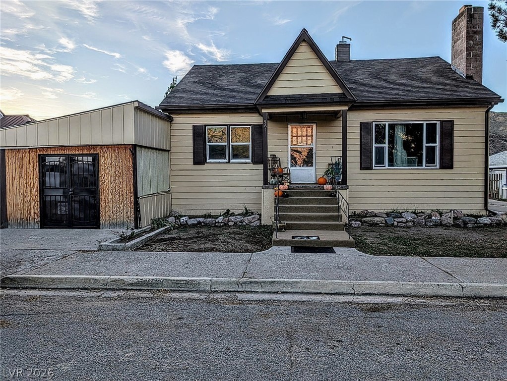 561 Main Street Caliente, NV 89008 - Photo 2 of 32 Bungalow-style home with a chimney and roof with shingles