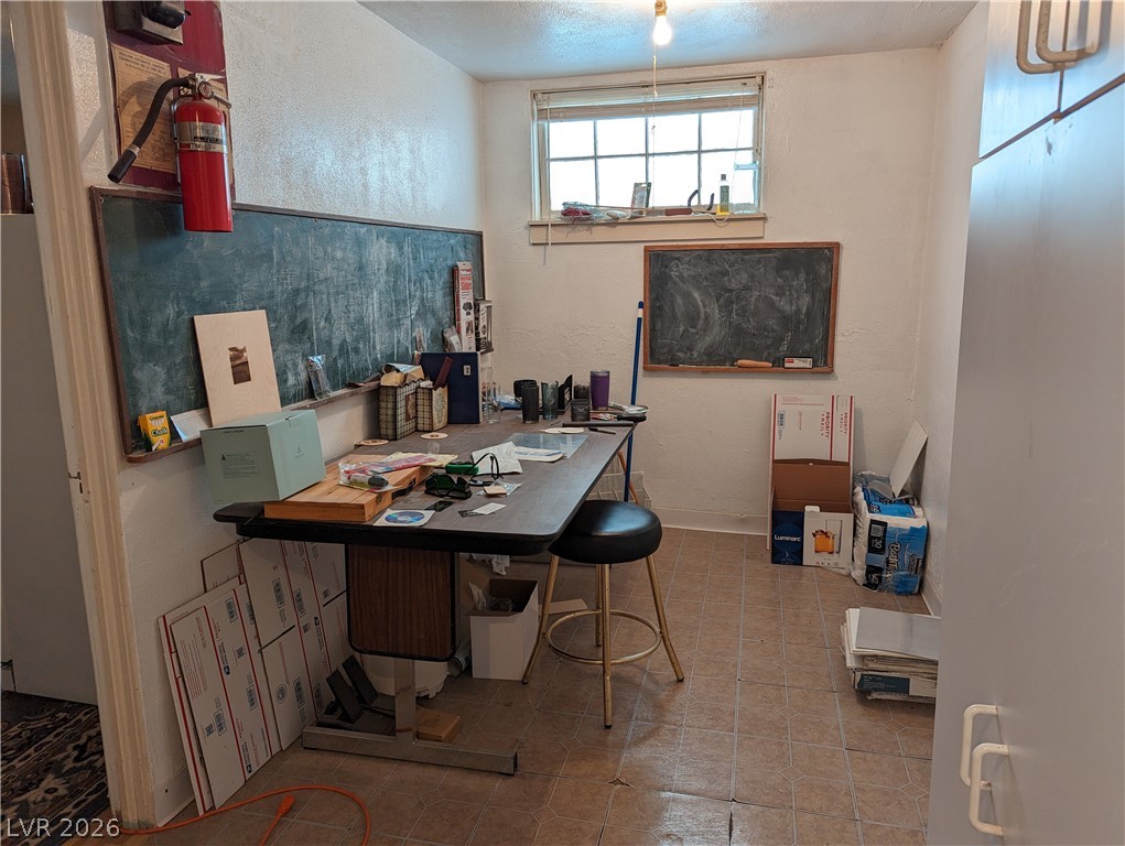 561 Main Street Caliente, NV 89008 - Photo 27 of 32 Office area with a textured wall and a textured ceiling