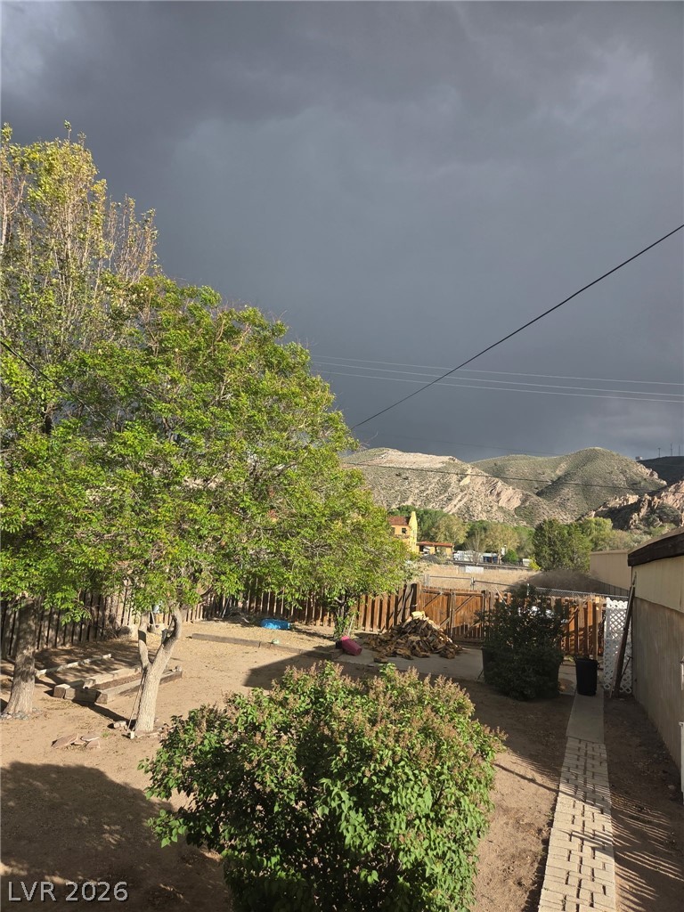 561 Main Street Caliente, NV 89008 - Photo 33 of 33 Backyard with storm clouds in view