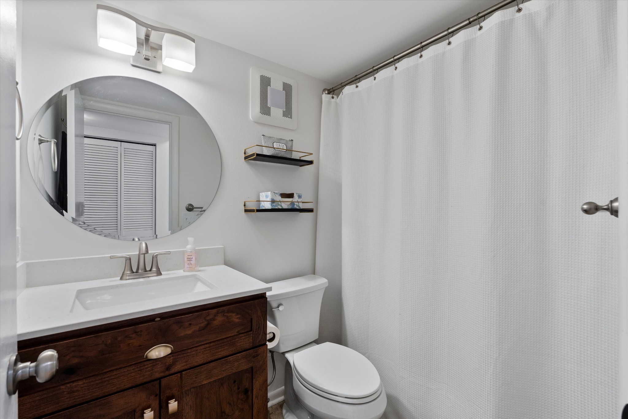 325 Summit Ridge Circle Nashville, TN 37215 - Photo 15 of 25 a bathroom with a toilet a sink and a mirror