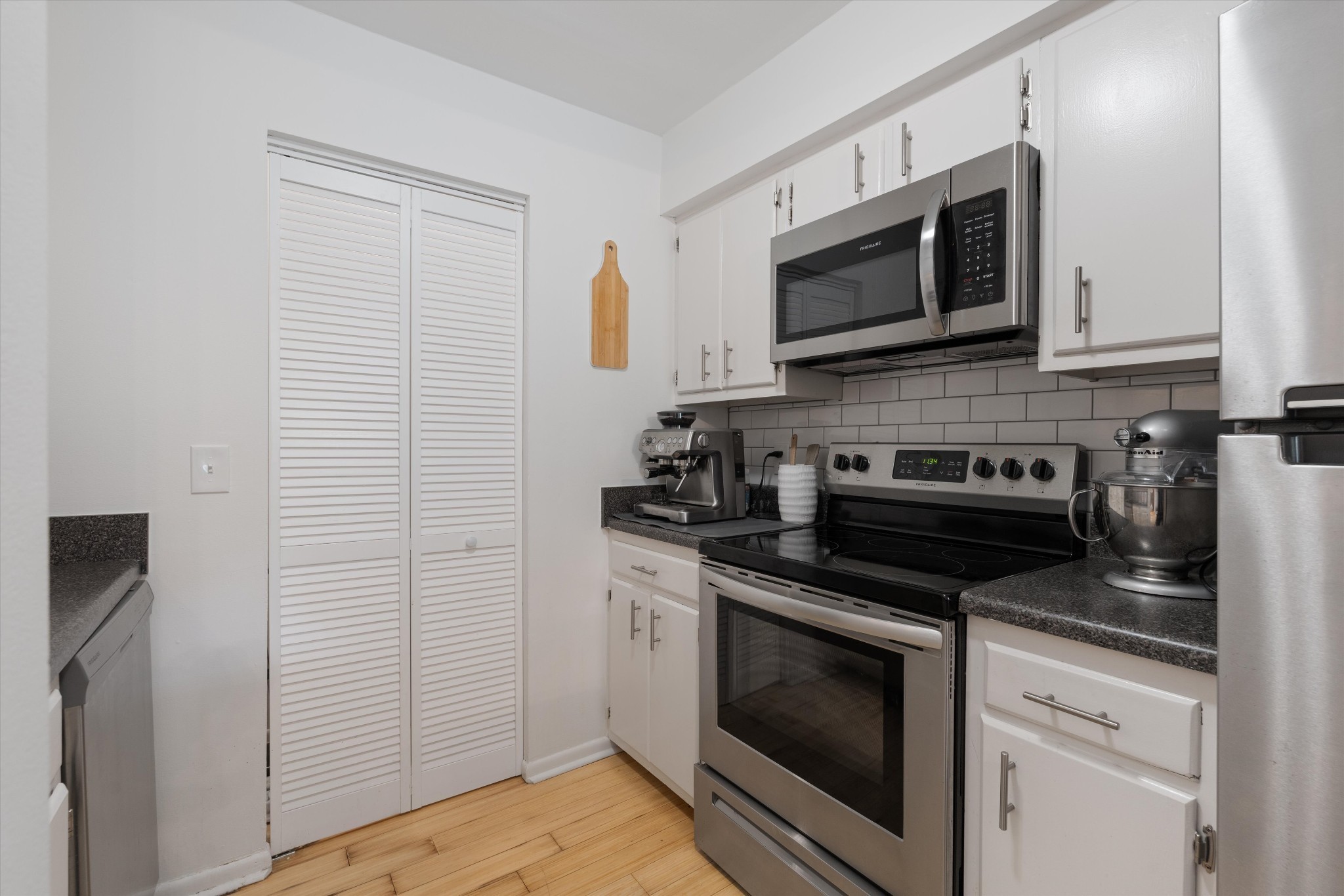 325 Summit Ridge Circle Nashville, TN 37215 - Photo 10 of 25 a kitchen with stainless steel appliances a stove microwave and sink