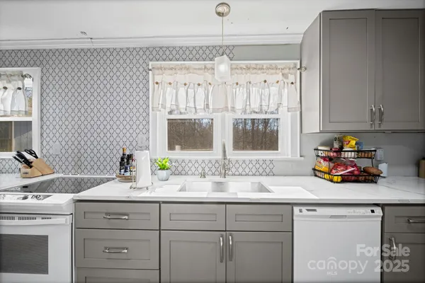a kitchen with a sink and a window