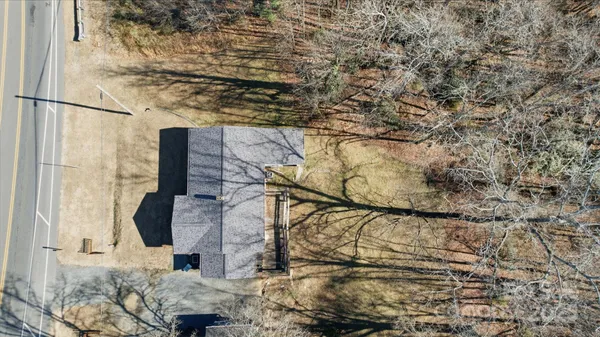 an aerial view of houses with trees