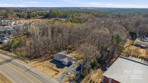 an aerial view of residential house with parking space