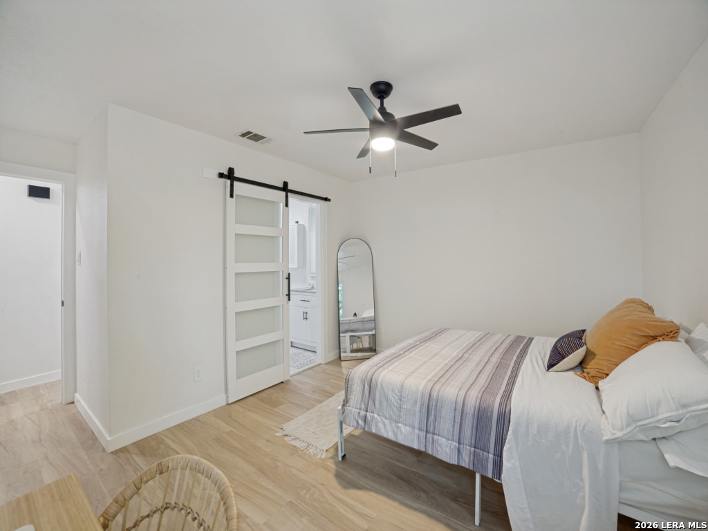 3439 Ridge Ranch San Antonio, TX 78247 - Photo 14 of 25 a bedroom with a bed and a ceiling fan
