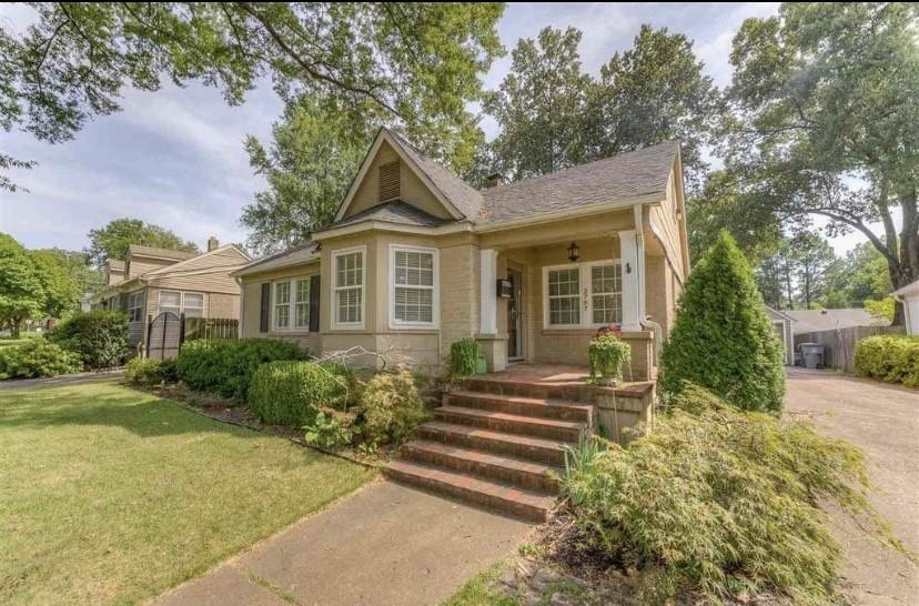 a front view of a house with garden