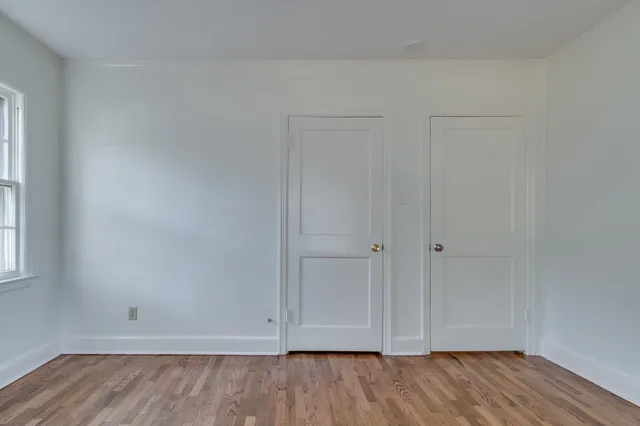 a view of room with hardwood floor
