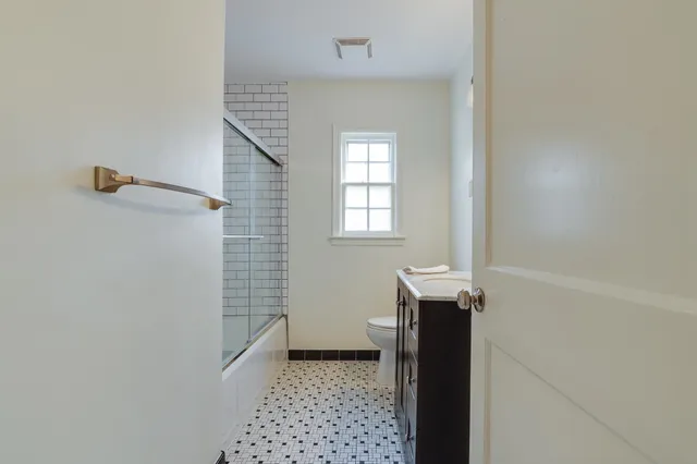 a bathroom with a sink and a shower