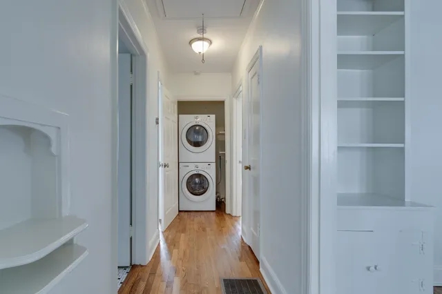 a view of a hallway with washer and dryer