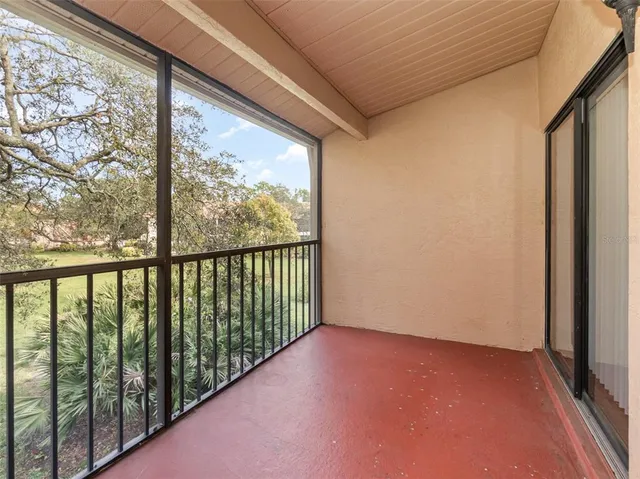 a view of a glass door and wooden floor