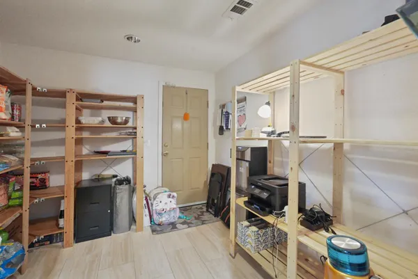 a view of a workspace with furniture