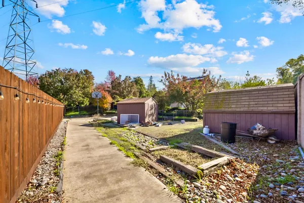 a view of a backyard with sitting area