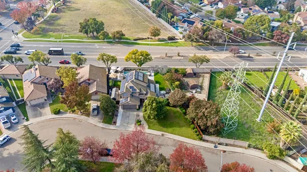 an aerial view of residential houses with outdoor space
