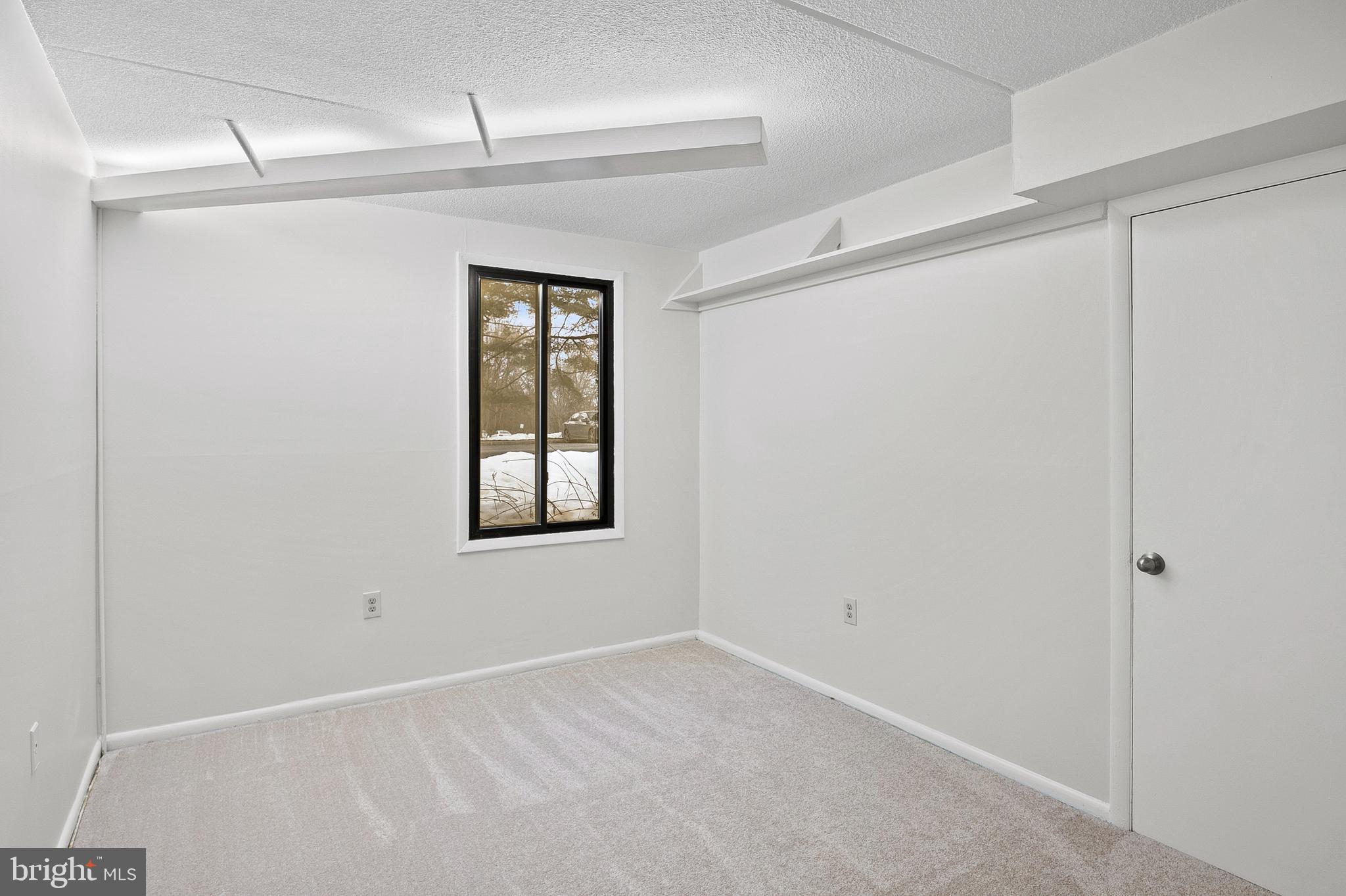 5232 West Running Brook Road, Unit 101 Columbia, MD 21044 - Photo 19 of 39 a view of an empty room with a window