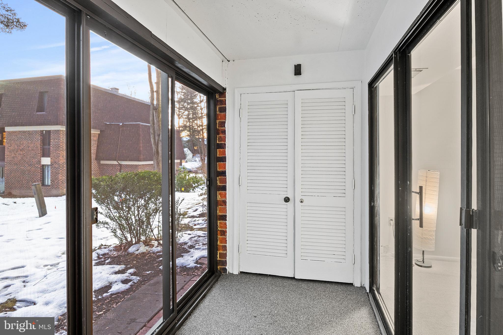 5232 West Running Brook Road, Unit 101 Columbia, MD 21044 - Photo 26 of 39 a view of a large window with an outdoor space