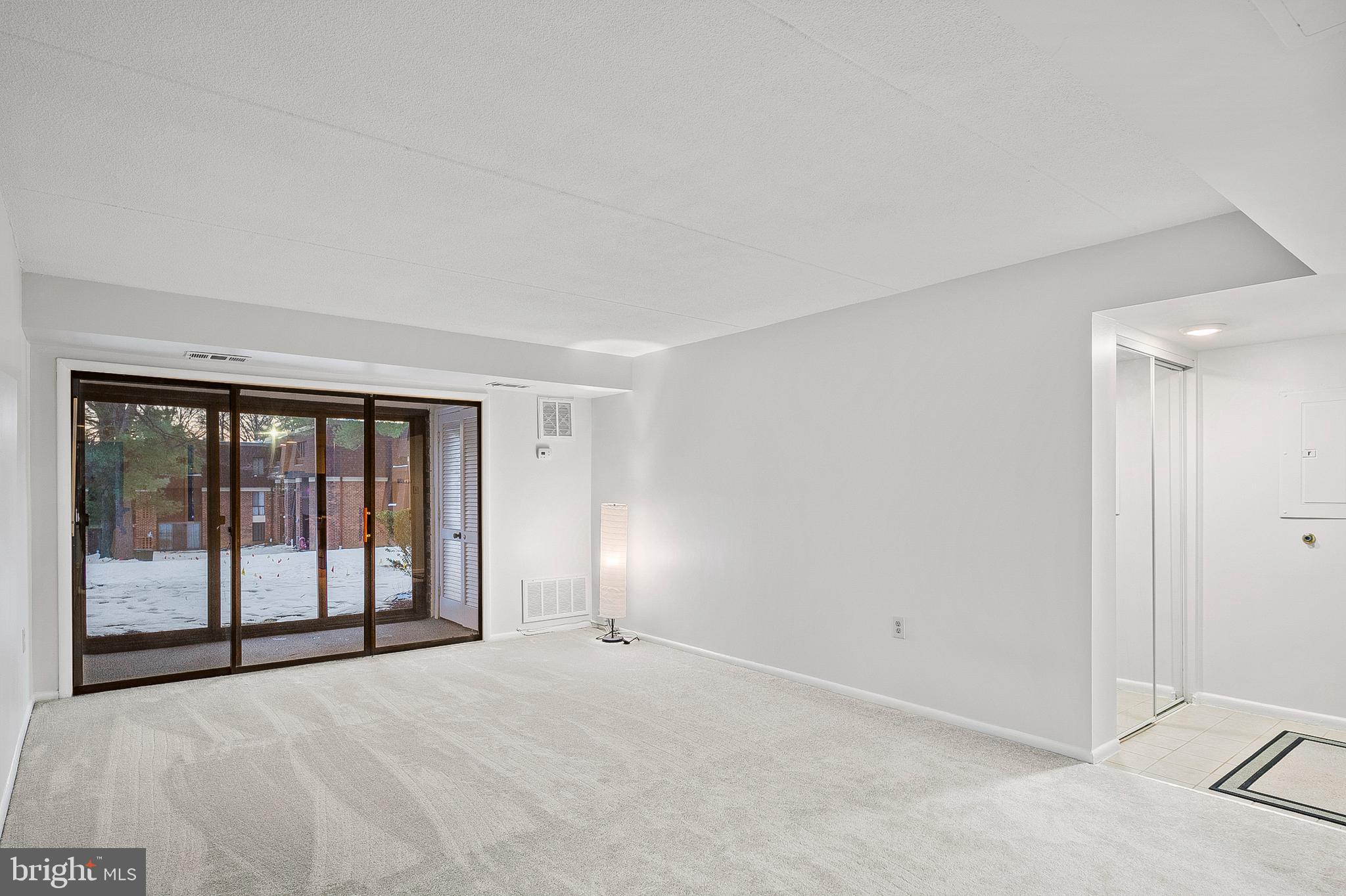 5232 West Running Brook Road, Unit 101 Columbia, MD 21044 - Photo 4 of 39 a view of an empty room with a window