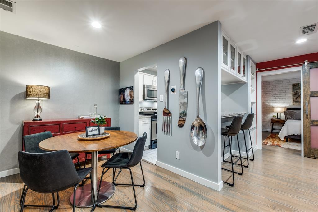 4231 Travis Street, Unit 17 Dallas, TX 75205 - Photo 14 of 26 a dining room with furniture and wooden floor