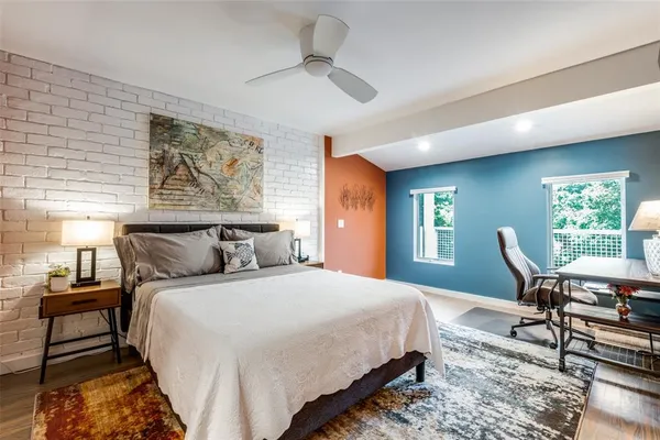 a bedroom with bed and a window