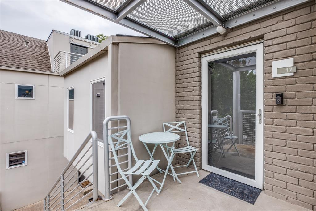 4231 Travis Street, Unit 17 Dallas, TX 75205 - Photo 7 of 26 a view of a patio with table and chairs and potted plants