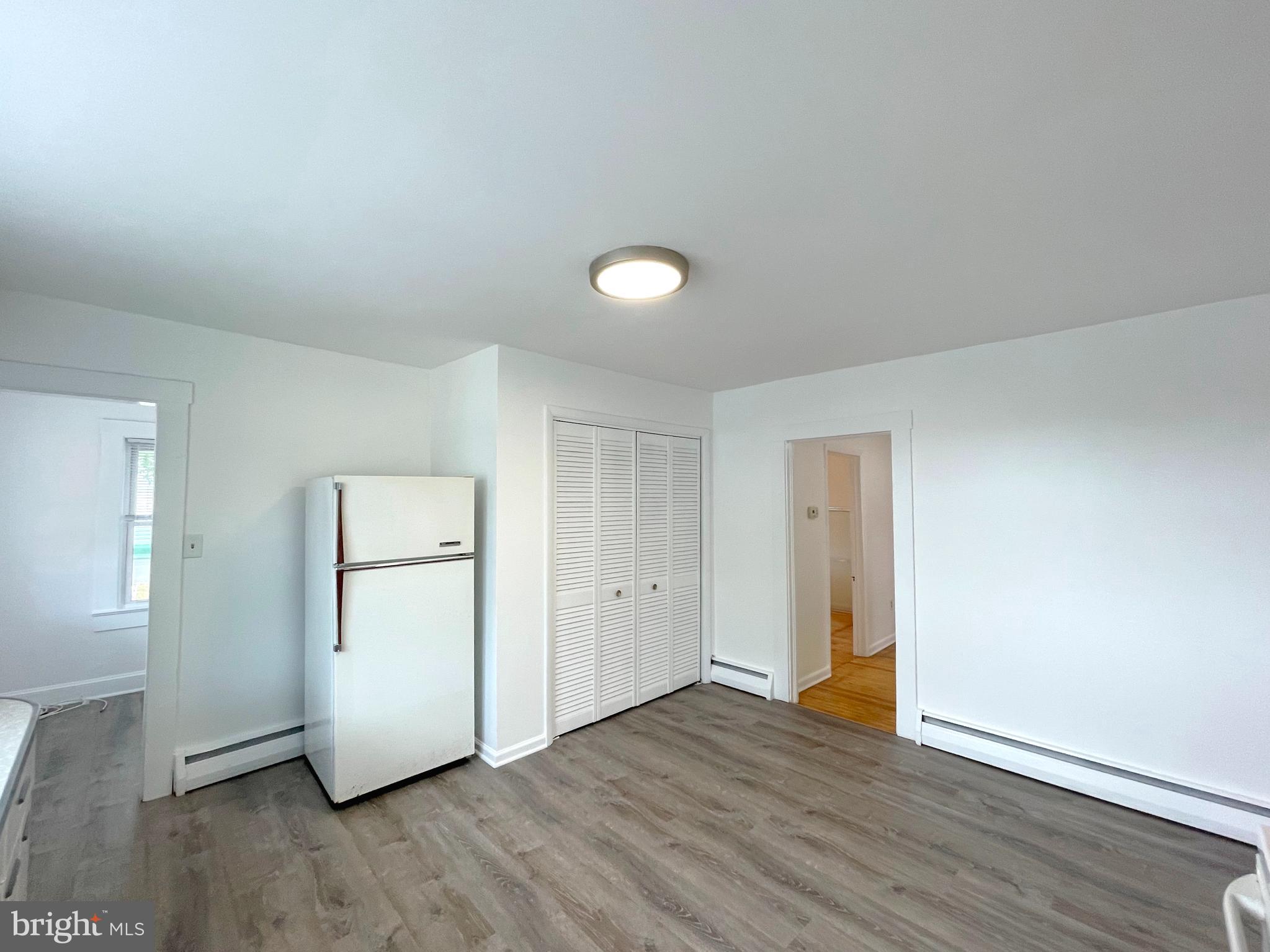 590 Hallowing Point Road Prince Frederick, MD 20678 - Photo 14 of 23 an empty room with wooden floor and windows