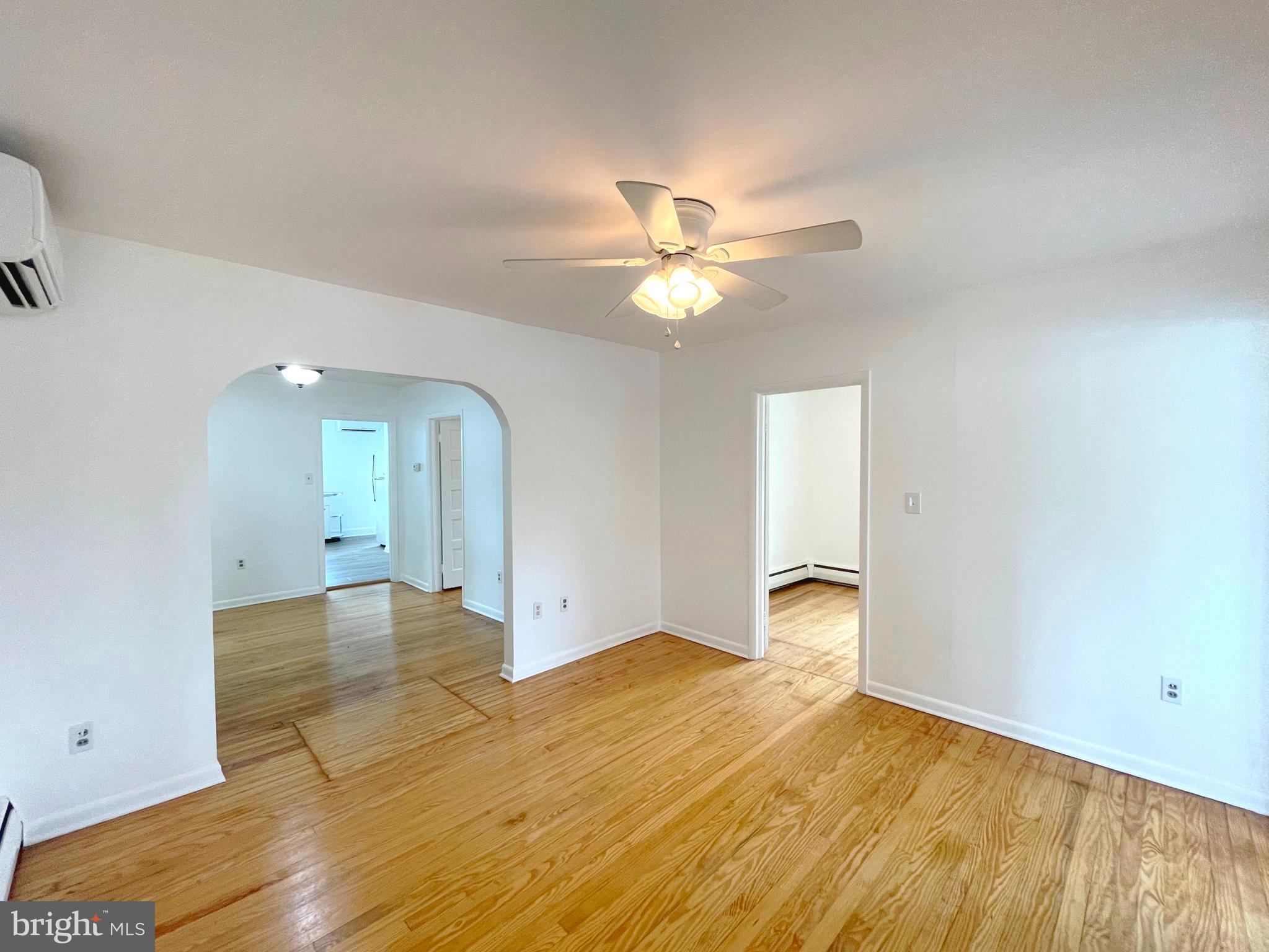 590 Hallowing Point Road Prince Frederick, MD 20678 - Photo 7 of 23 wooden floor in an empty room with a window