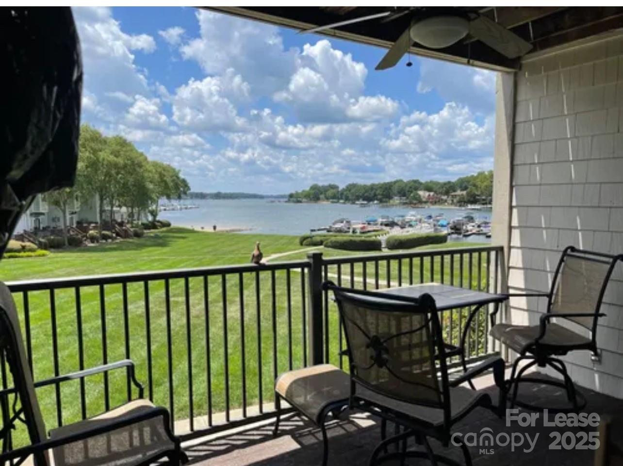18701 Nautical Drive, Unit 203 Cornelius, NC 28031 - Photo 1 of 13 a view of a chairs and table in the balcony