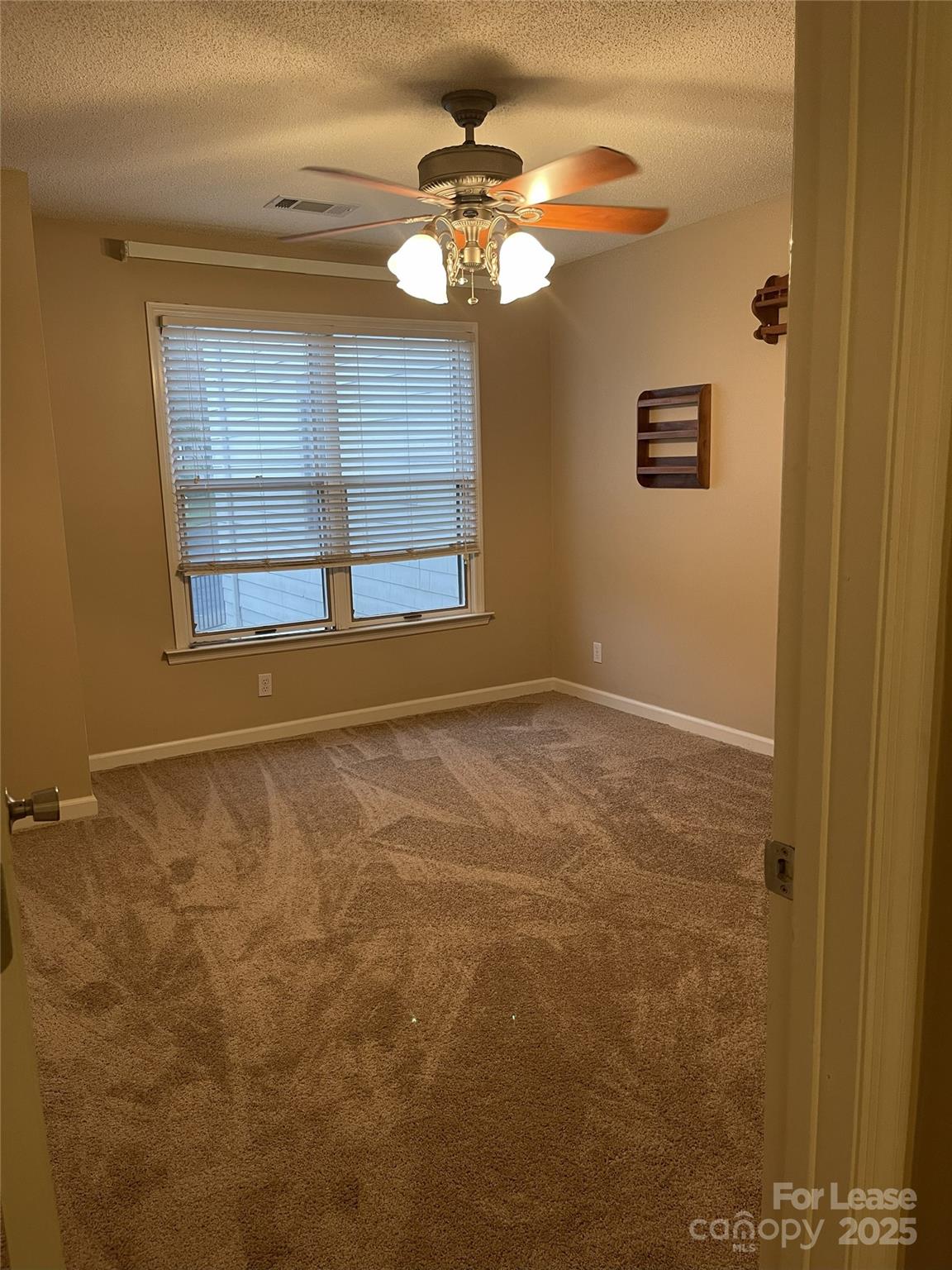 18701 Nautical Drive, Unit 203 Cornelius, NC 28031 - Photo 12 of 13 a view of an empty room with a window