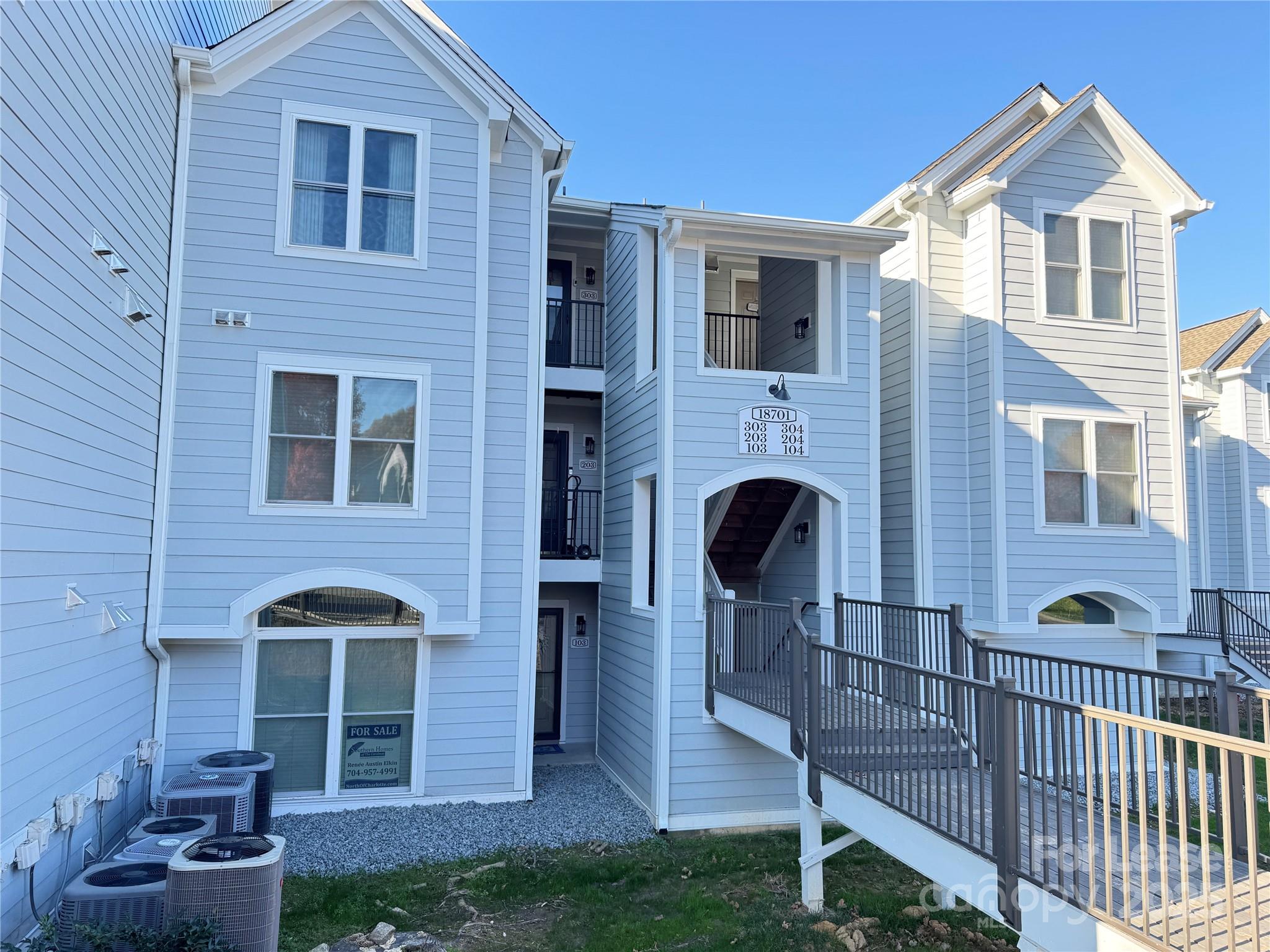 18701 Nautical Drive, Unit 203 Cornelius, NC 28031 - Photo 5 of 13 a front view of a house with yard