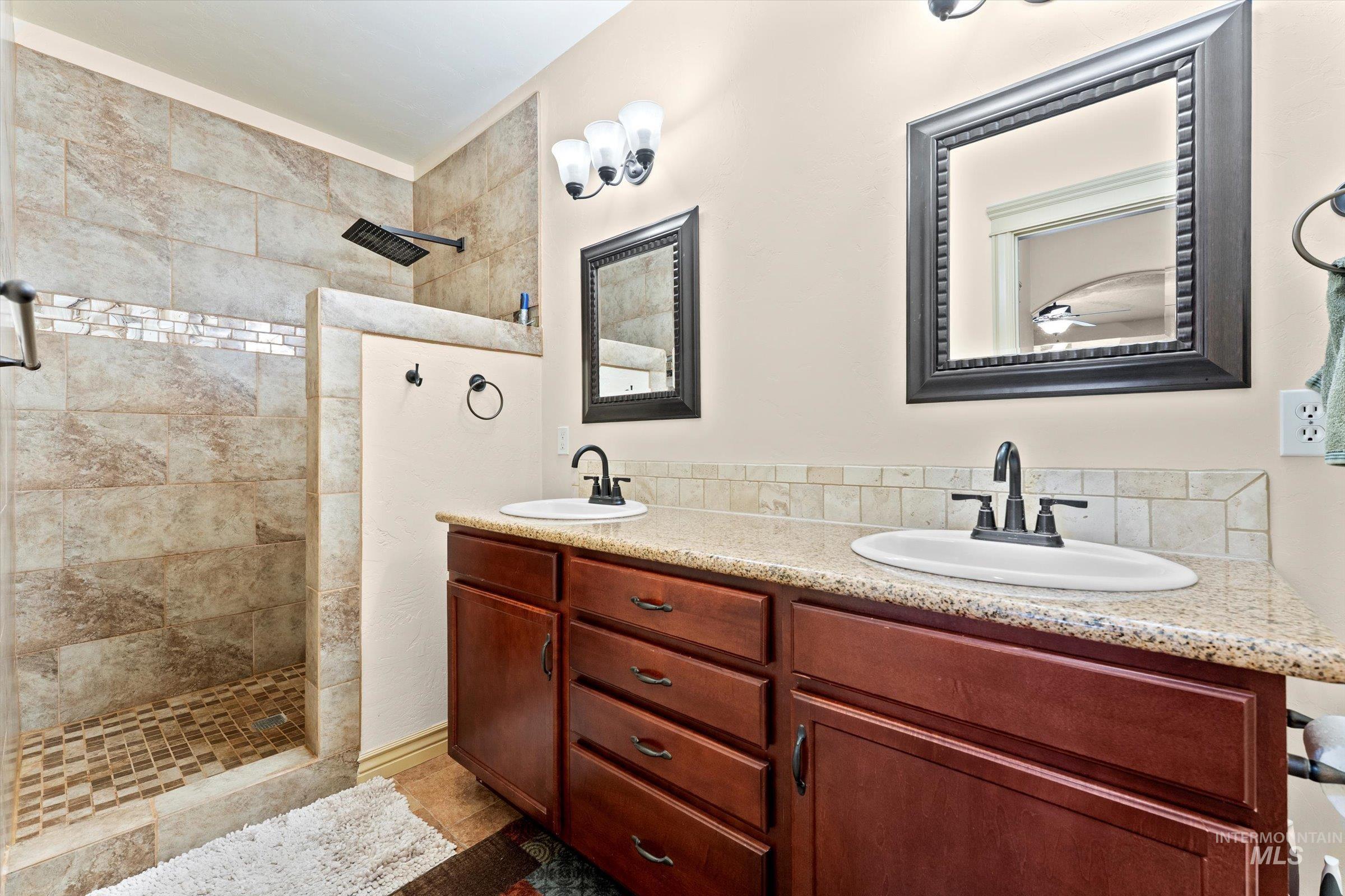176 East Breinholt Street Meridian, ID 83646 - Photo 16 of 39 Bathroom with walk in shower and double vanity