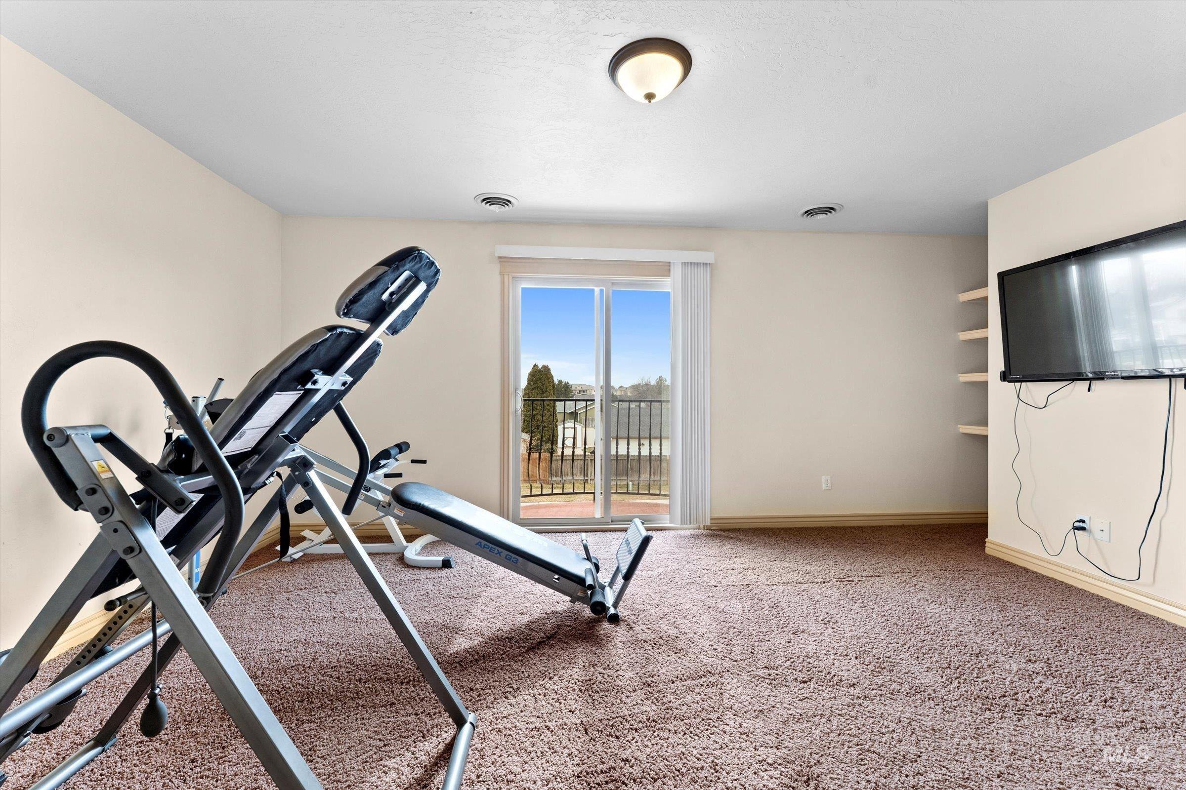 176 East Breinholt Street Meridian, ID 83646 - Photo 19 of 39 Workout area featuring baseboards and light carpet