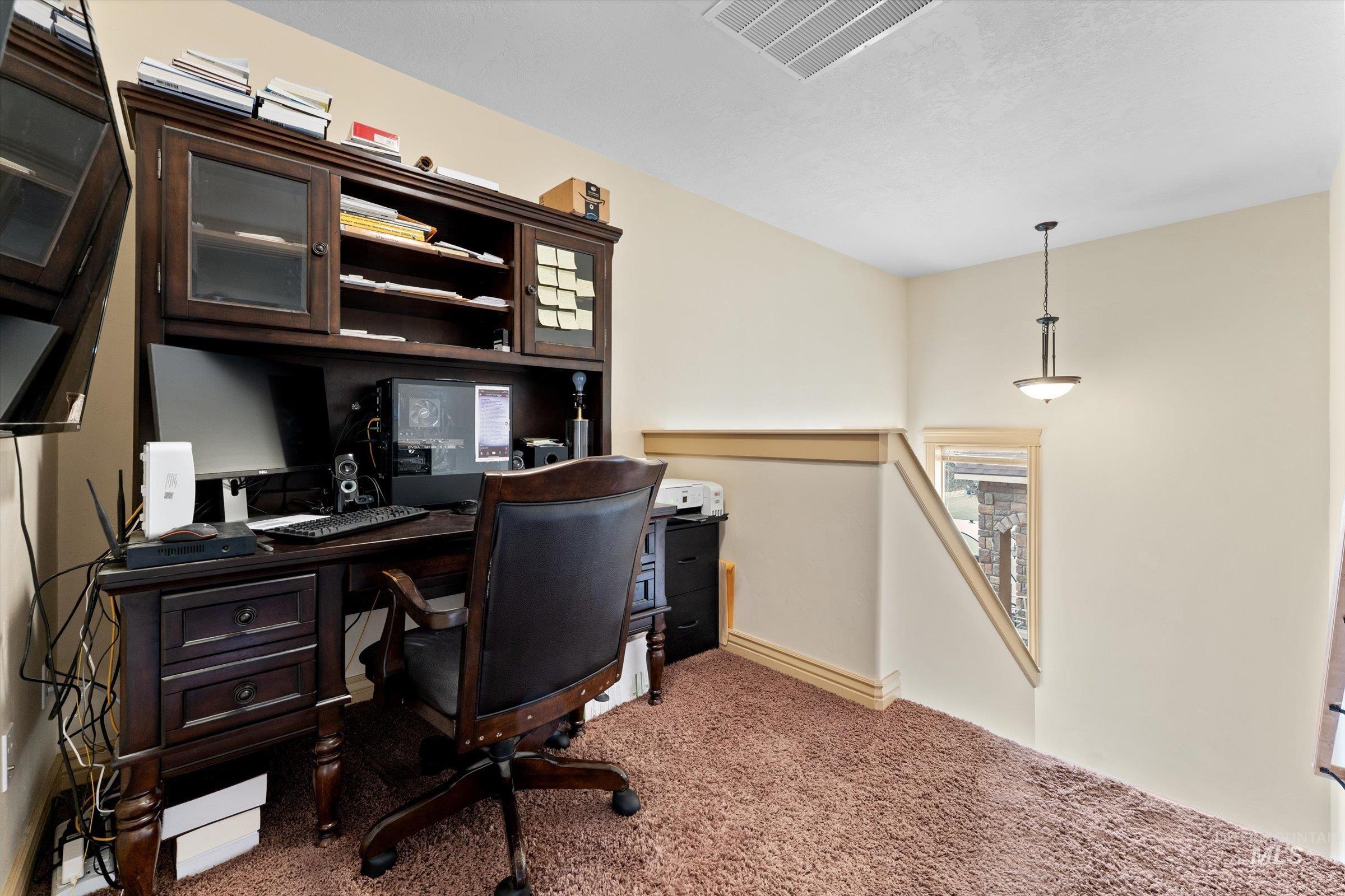 176 East Breinholt Street Meridian, ID 83646 - Photo 26 of 39 Office area with light colored carpet and baseboards