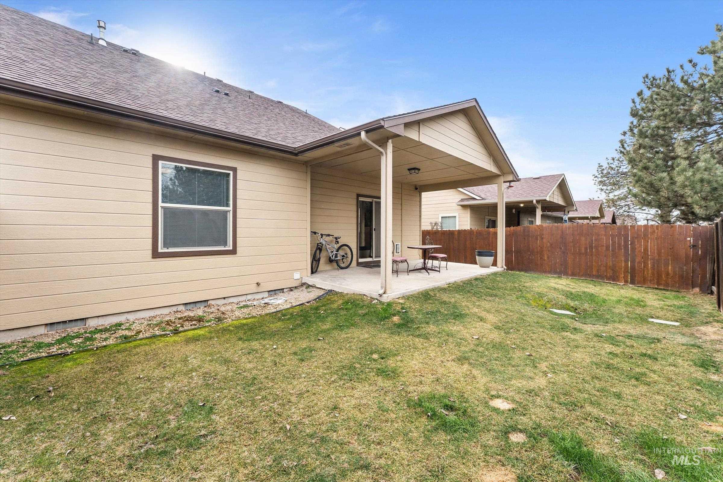 176 East Breinholt Street Meridian, ID 83646 - Photo 27 of 39 Rear view of property with a patio, crawl space, and roof with shingles