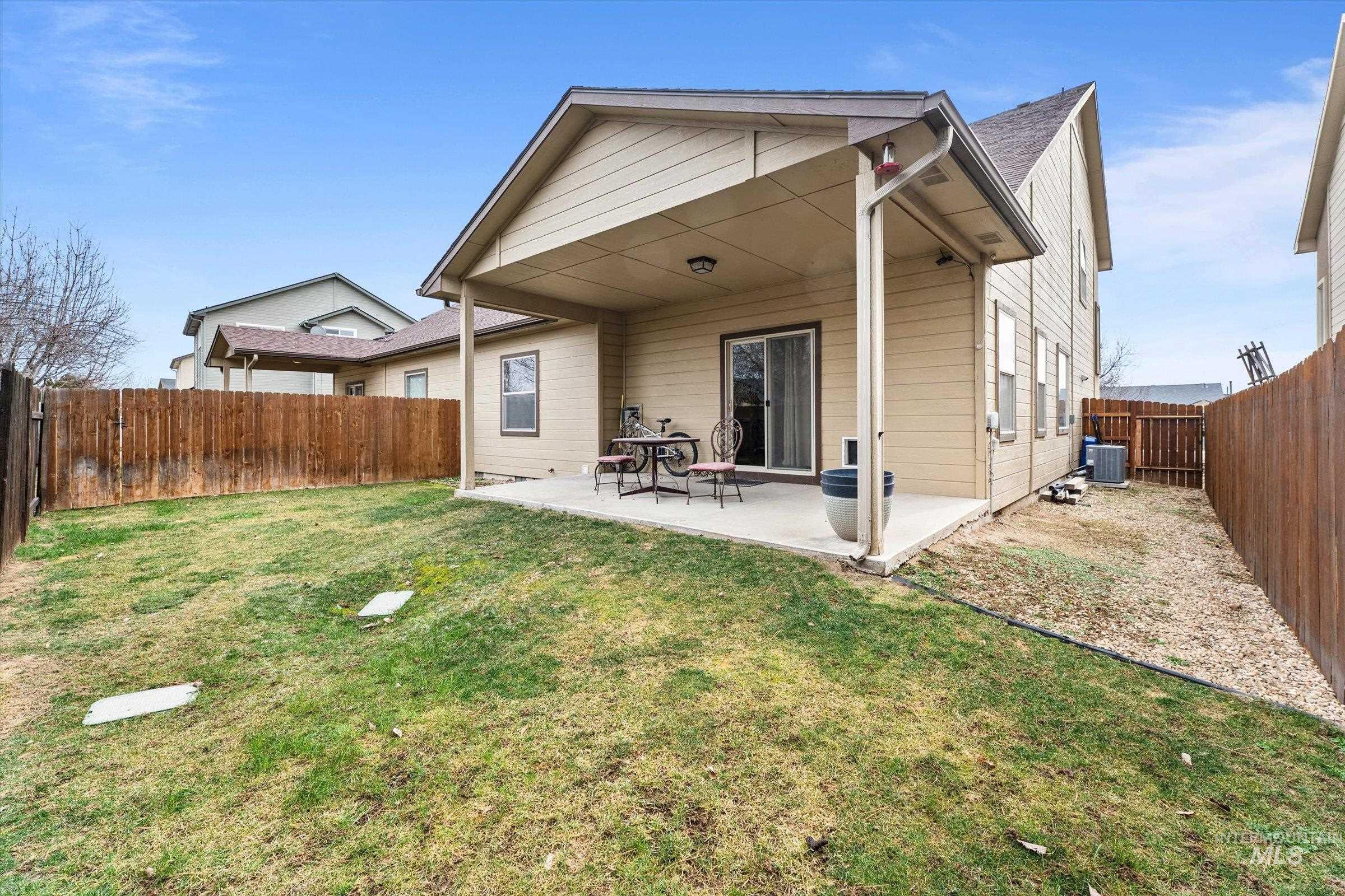 176 East Breinholt Street Meridian, ID 83646 - Photo 28 of 39 Rear view of house featuring a patio area and a fenced backyard