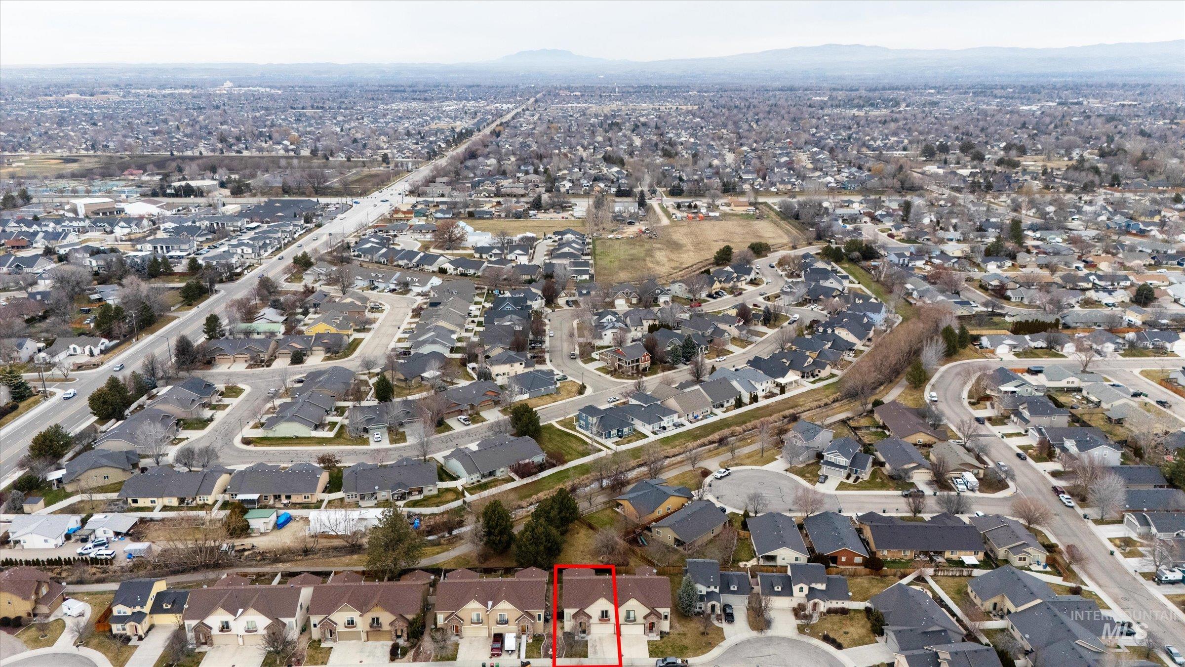 176 East Breinholt Street Meridian, ID 83646 - Photo 39 of 39 Aerial view of property's location featuring nearby suburban area and mountains