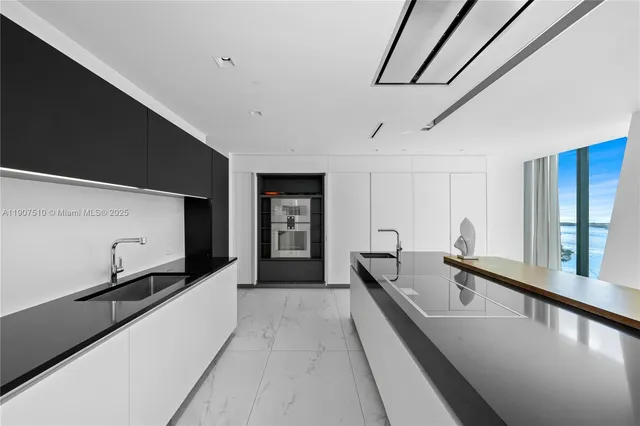 a bathroom with a sink toilet vanity and shower