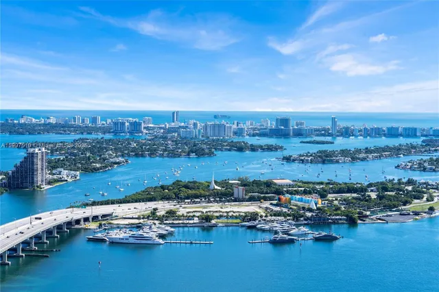 a living room with furniture large windows and a flat screen tv