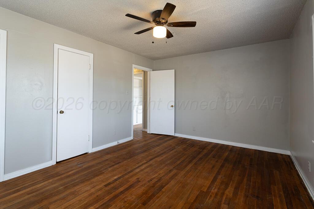 600 South Nelson Street Amarillo, TX 79104 - Photo 8 of 14 wooden floor in an empty room