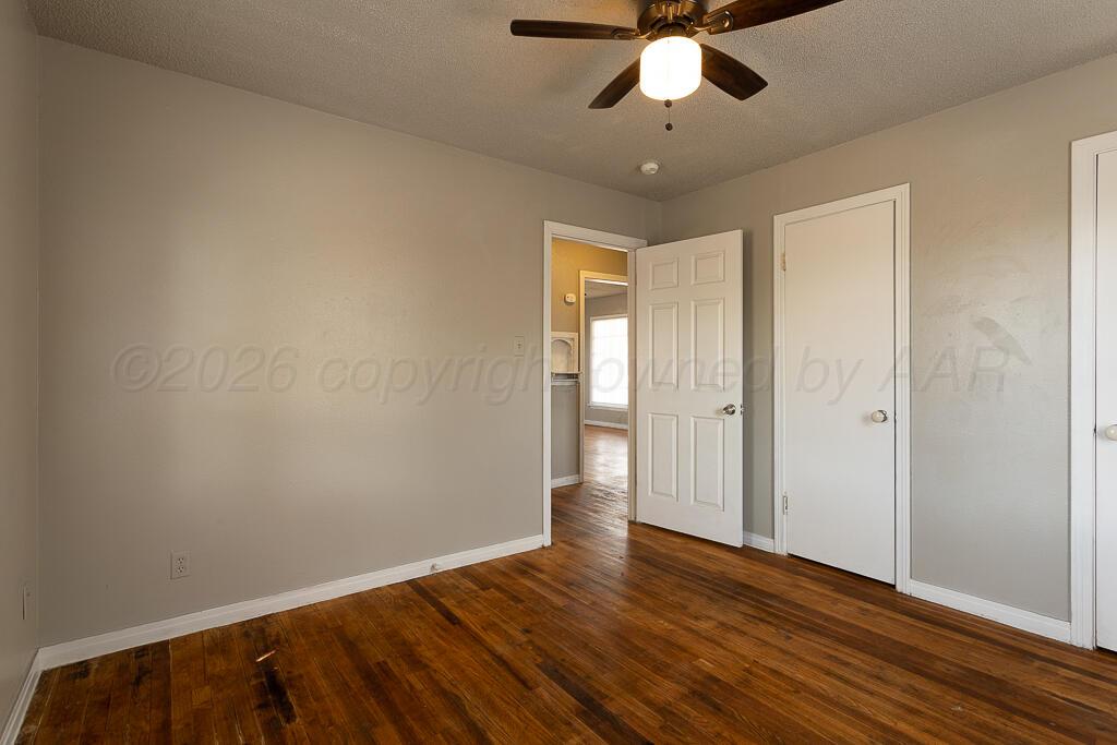 600 South Nelson Street Amarillo, TX 79104 - Photo 10 of 14 wooden floor in an empty room
