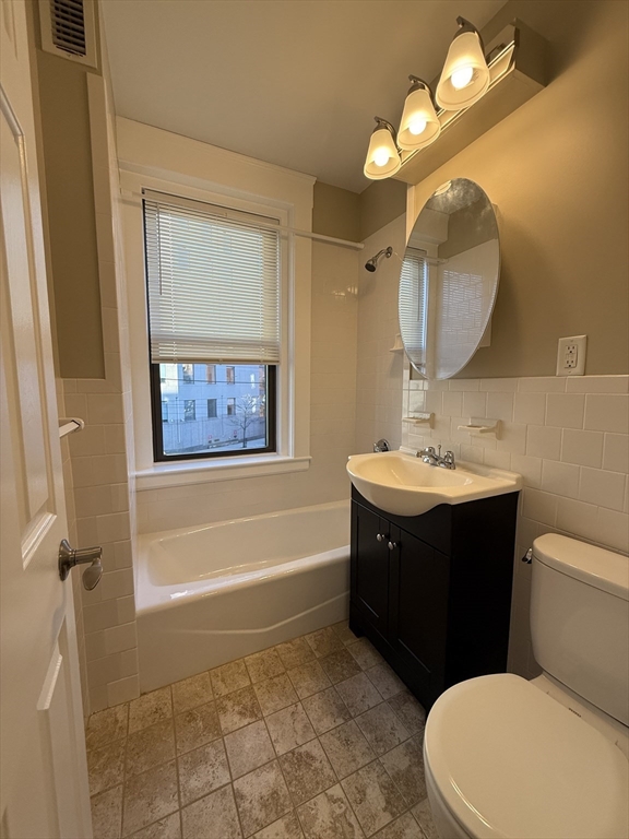 660 Huntington Avenue, Unit 23 Boston, MA 02115 - Photo 6 of 23 a bathroom with a sink vanity mirror and toilet