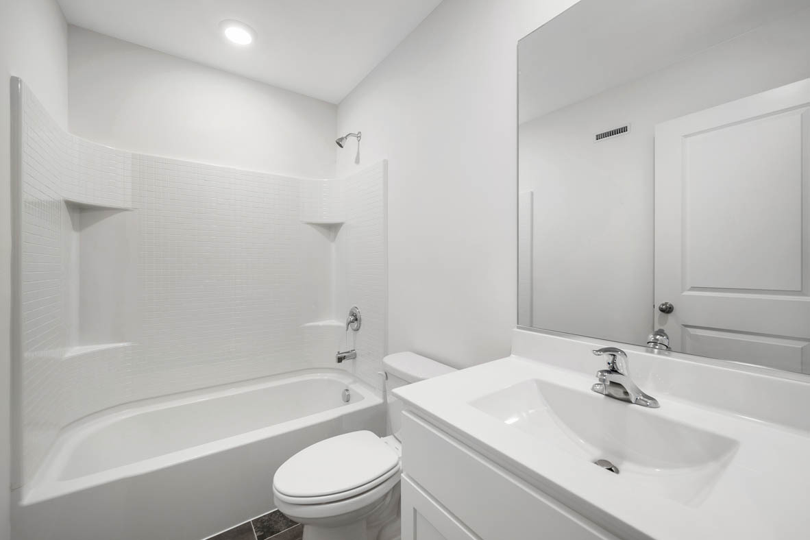1478 Yosemite Way Pingree Grove, IL 60140 - Photo 14 of 18 a bathroom with a sink toilet and shower