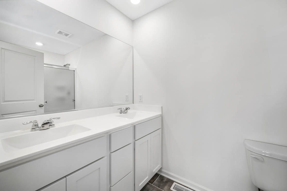1478 Yosemite Way Pingree Grove, IL 60140 - Photo 17 of 18 a bathroom with a sink and a mirror