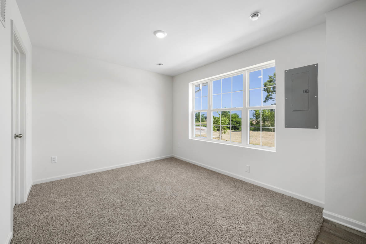 1478 Yosemite Way Pingree Grove, IL 60140 - Photo 4 of 18 an empty room with windows