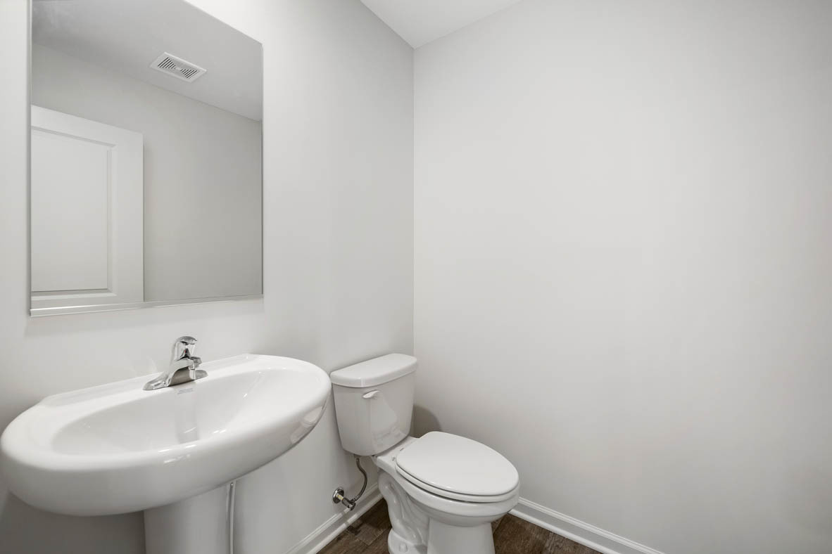 1478 Yosemite Way Pingree Grove, IL 60140 - Photo 5 of 18 a white toilet sitting next to a white sink